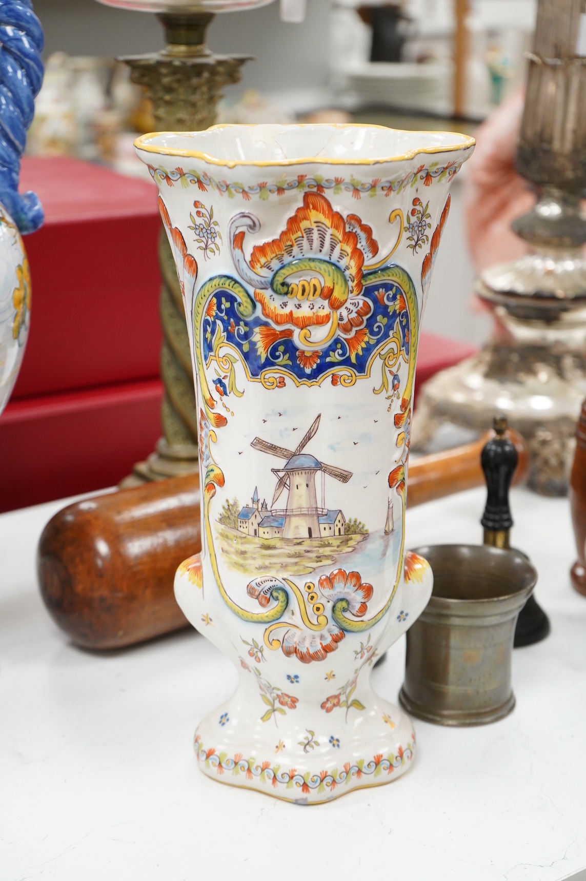 Two large French faience jugs and a vase, and a Talavera twin handled urn/vase, 44cm high